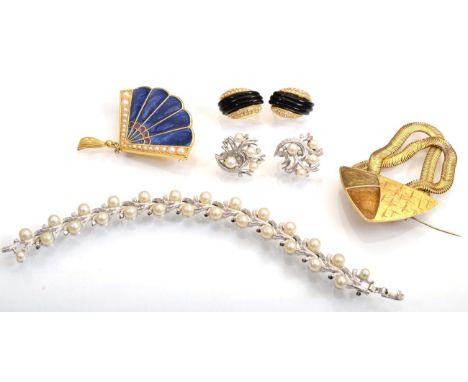 A Trifari simulated pearl bracelet and earring suite, of silvered metal branch motif links interspersed by simulated pearls, 