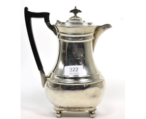 A silver hot water jug, William Hutton, Sheffield 1936, rounded rectangular on ball support, 23cm high, 24ozt 