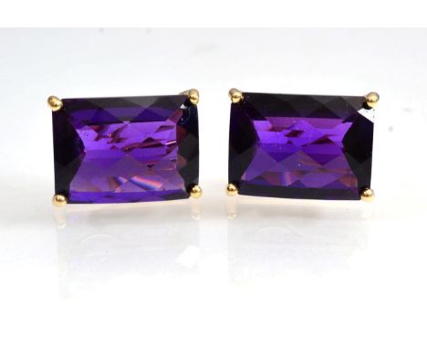 A pair of 14 carat gold amethyst earrings, rectangular checker-board cut amethyst in claw settings, measures 18mm by 13mm, wi