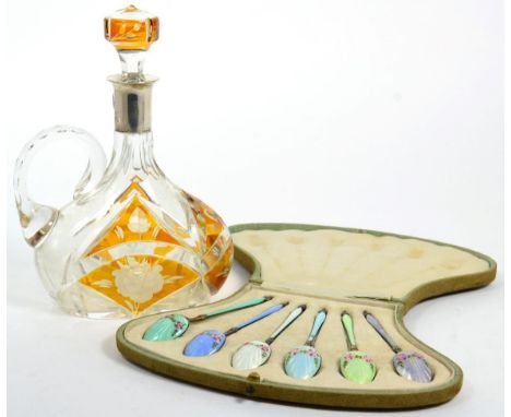 A Bohemian glass amber overlay decanter and stopper with silver collar stamped 800; also a set of six sterling silver and gui