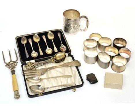 Nine silver napkin rings, most of a heavy gauge; a George III silver King's pattern table fork; a set of six teaspoons; a set