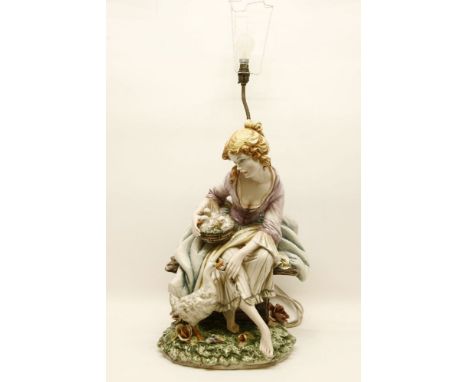 A large Italian ceramic figural lamp base, in the form of a young girl tending geese, signed to reverse, 54cm high