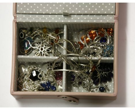 A small jewellery box containing a quantity of silver gem set jewellery, including a silver amber cabochon bracelet, a four s