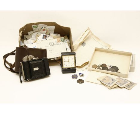 An Ikona camera, medals, stamps and travelling clock