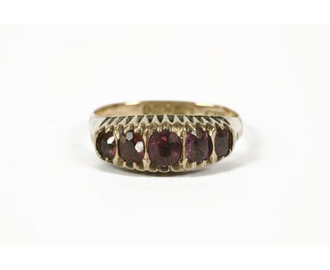 A five stone graduated garnet ring, with later replacement half shank2.44g