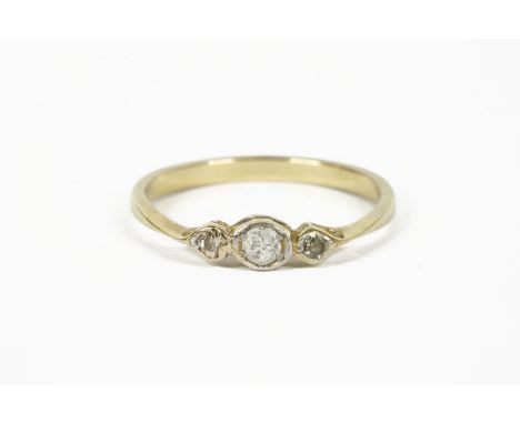 A gold  three stone diamond ring (tested as approximately 18ct gold)