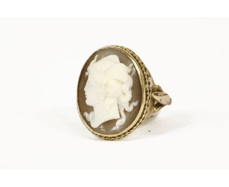 A gold shell cameo ring, carved of a Grecian or Roman type maiden (tested as approximately 9ct)7.32g