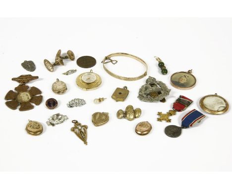 A collection of jewellery to include two rolled gold picture lockets, three front and back lockets, a gilt metal Harrier Jump