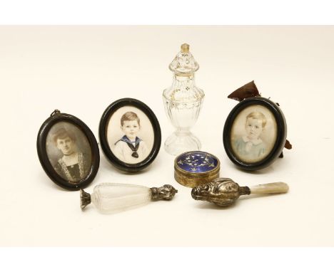 A Victorian silver and mother of pearl baby's rattle, together with a gilt metal and blue enamel pill box and three miniature