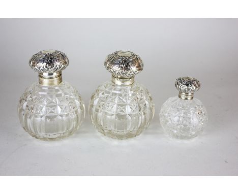 A pair of Victorian silver mounted cut glass dressing table scent bottles, maker William Hutton & Sons Ltd, Birmingham 1900, 