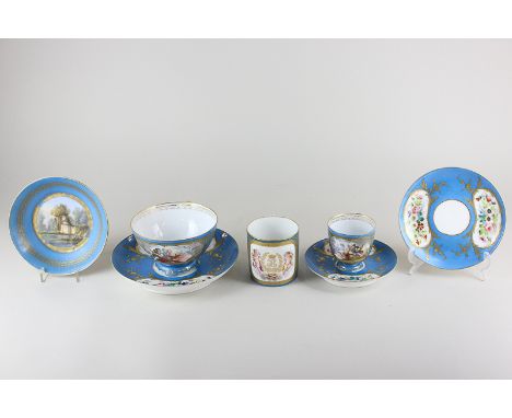 A 19th century Sevres Chateau Des Tuileries teacup decorated with putti around gilt interlaced L's, with Celeste blue borders