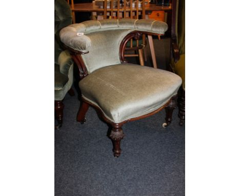 A Victorian upholstered bow back 'cockfighter' chair with scroll carved frame, on unusual carved stud baluster feet and casto