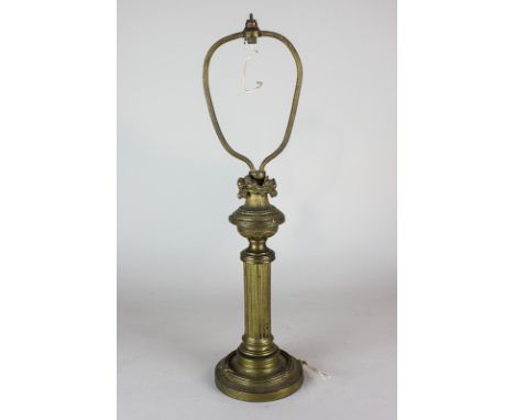 A gilt metal table lamp, with urn and column stem, on circular base 44cm high (NC)