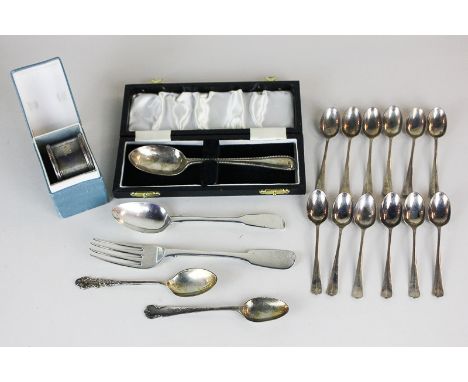 A set of twelve George V silver coffee spoons, maker Cooper Brothers  Sons Ltd, Sheffield 1925, together with a silver napkin