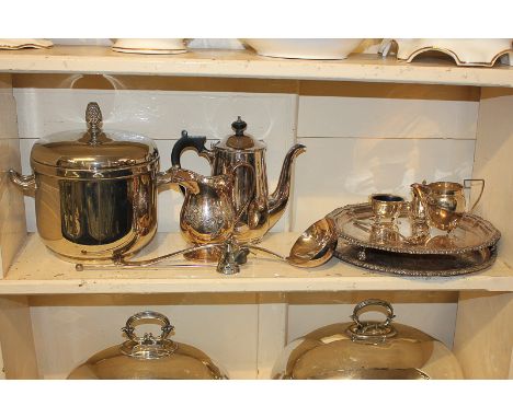 A group of silver plated items including an ice bucket, a salver, a tray, a coffee pot, a ladle and other items