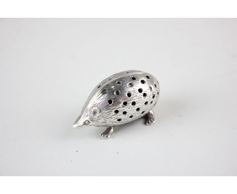 A white metal hedgehog hatpin cushion marked 925, 4cm long