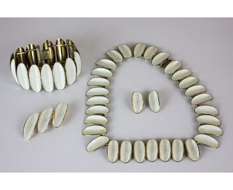David Andersen, a silver gilt and enamel Willy Winnaess necklace the curled oval links guilloche enamelled in white, with a m