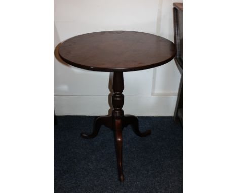 A George III mahogany tripod table with fold-down circular top, on turned baluster stem, 61cm