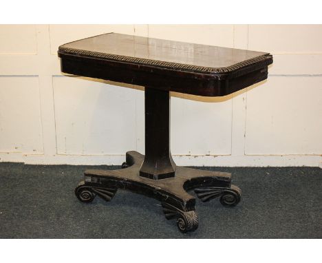 A Victorian rosewood card table, the rectangular swivel top with gadrooned border, on pedestal support and quatreform base, w