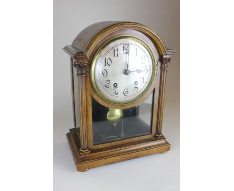 A Winterhalder & Hofmeier carved wood and bevelled glass cased bracket clock, the Arabic numerals on silverised dial, with qu