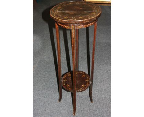 An Edwardian painted jardiniere stand with circular top and under shelf, decorated with ribbons and garlands of flowers, 34cm