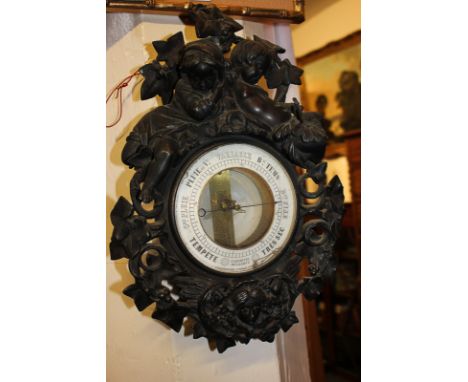 A 19th century French barometer, circular dial marked E Bourdon and Richard Brevetes, Paris, in bronze metal case cast with a