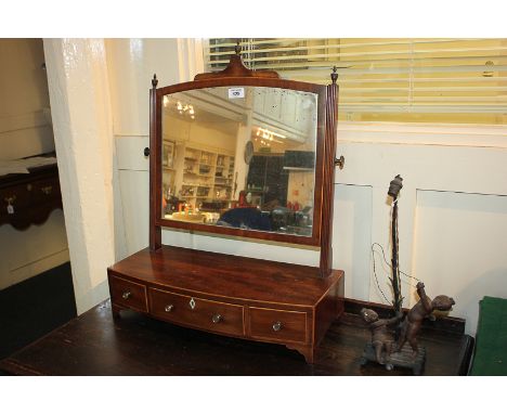 A George III mahogany bow front dressing table mirror on reeded supports and box base with three drawers, on bracket feet, 52