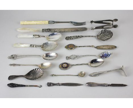A Chinese white metal caddy spoon, a silver and mother of pearl handled caddy spoon, and a silver teaspoon, the handle with p