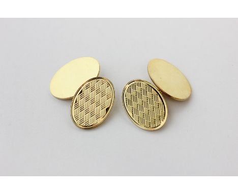 A pair of 18ct gold cufflinks, the ovals engine turned, 13.3g