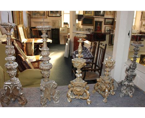 Two pairs of giltwood and gesso pricket candlesticks, in distressed condition, and another single and part candlestick, talle