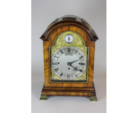 A mahogany chiming mantel clock in domed case, with silvered dial marked Harvey, London, with strike silent dial, the movemen