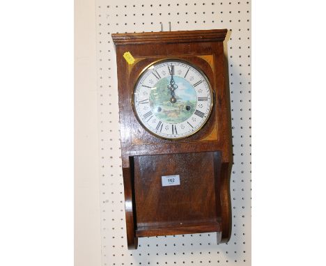 A WALL CLOCK WITH DECORATED FACE
