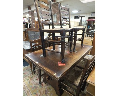 AN OAK DRAW LEAF DINING TABLE &amp; SIX LADDER BACK CHAIRS