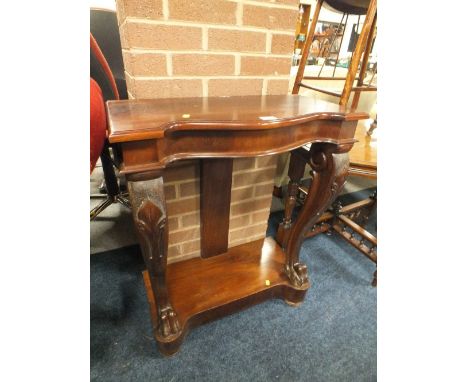 A 19TH CENTURY MAHOGANY CONSOLE TABLE WITH PAW FOOTED CABRIOLE LEGS