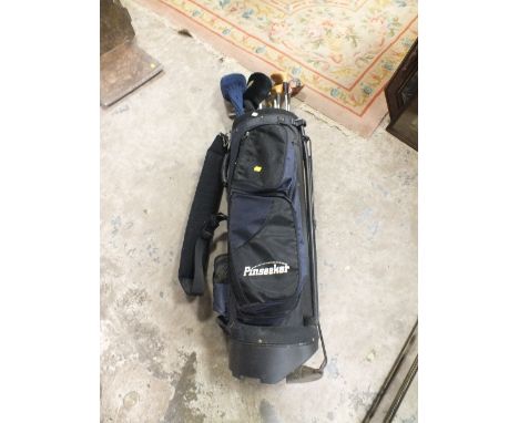 A SELECTION OF GOLF CLUBS ALONG WITH A PINSEEKER CADDY BAG