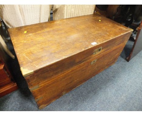 AN ANTIQUE BRASS BOUND CAMPHOR WOOD TRUNK