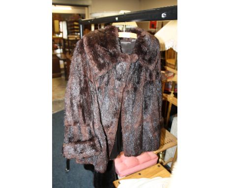 A LADIES VINTAGE BROWN FUR JACKET
