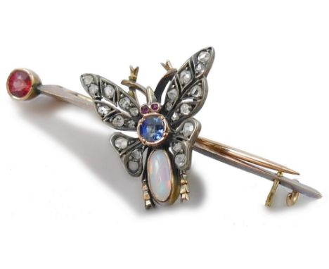 A Victorian multi gem set butterfly brooch, circa 1890, the thorax set with an opal, the body a sapphire, ruby set eyes and r