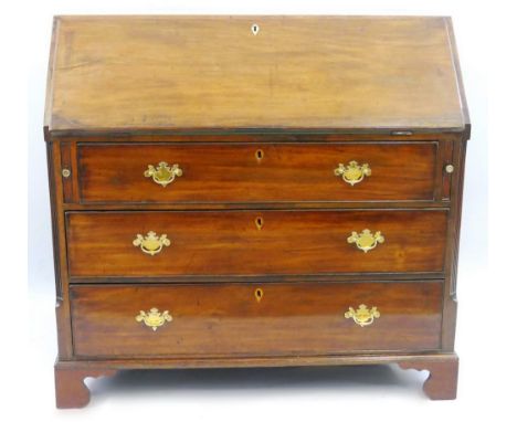A George III mahogany bureau, the fall front opening to reveal a fitted interior with inset writing surface, pigeon holes, dr