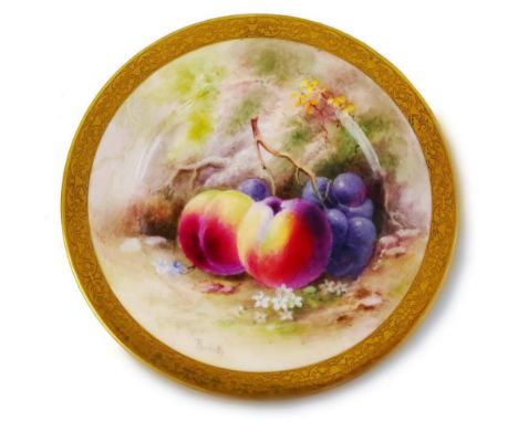 A Royal Worcester cabinet plate, painted with peaches and grapes in a landscape, signed Ricketts within an ornate gilt border