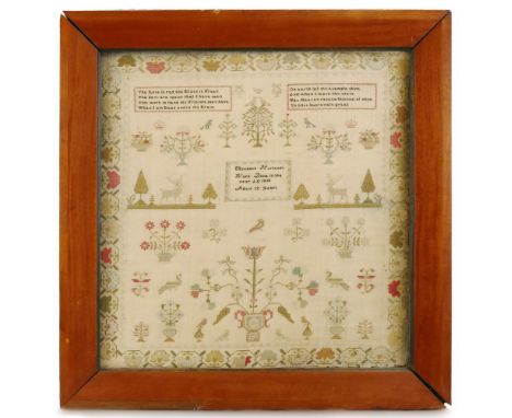 A William IV needlework sampler, worked by Elizabeth Harlands aged twelve 1830, depicting a framed title and two religious ve