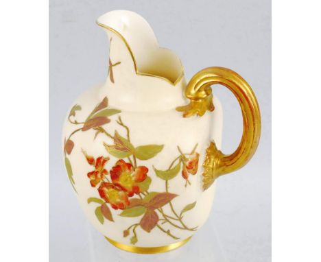 A Royal Worcester flat back jug, painted and gilded with flowers and leaves on an ivory coloured ground with gilt edges and f