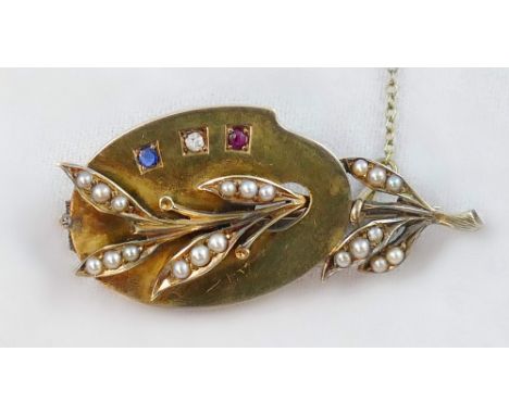 A Victorian gold and gem set brooch, unmarked in the form of an artists palette and floral spray, set with a sapphire, diamon