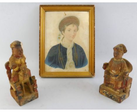 A pair of Chinese carved hardwood figures,  of an Emperor and Empress carved from the solid seated on thrones, traces of gild