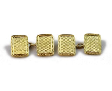 An 18ct gold Art Deco pair of cufflinks, Birmingham 1926, of rectangular form with engine turned decoration, weight 7.4 grams