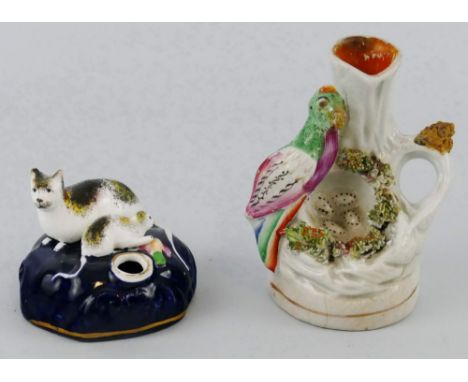 A Victorian Staffordshire pen holder, modelled as a cat and kitten on a blue glazed rocky base 7cm wide and a Victorian Staff