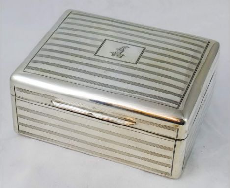 A silver cigarette box, by Mappin & Webb, London 1916, of rectangular form, engine turned decoration, crest, 11 x 9 x 5 cm.