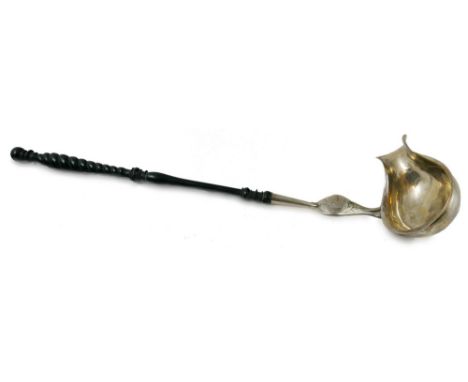 A mid 19th century German silver punch ladle, maker untraced, Hamburg, the oval bowl with pouring lip, the mount with floral 