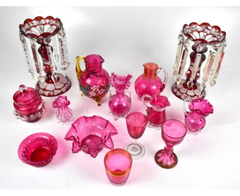 A pair of ruby glass lustres with clear drops (one af) and a group of cranberry glass including dish with crimped rim, cups, 