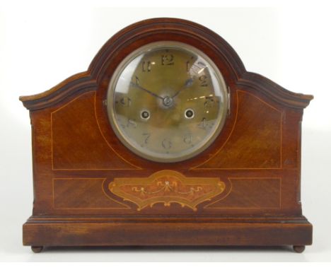 An Edwardian inlaid mahogany mantel clock, the central brass dial set with Arabic numerals, raised on bun feet, height 30.5cm